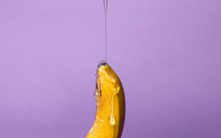 Banana with lube being poured on it.